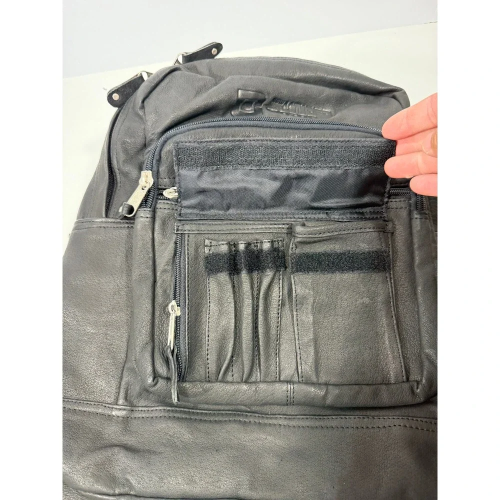 New United Motor Manufacturing Black Leather Backpack Multi Pocket YKK Zipper